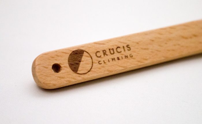 Crucis Climbing Logo etched on to oak climbing brush handle